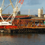 Metal structure floating on flat boat